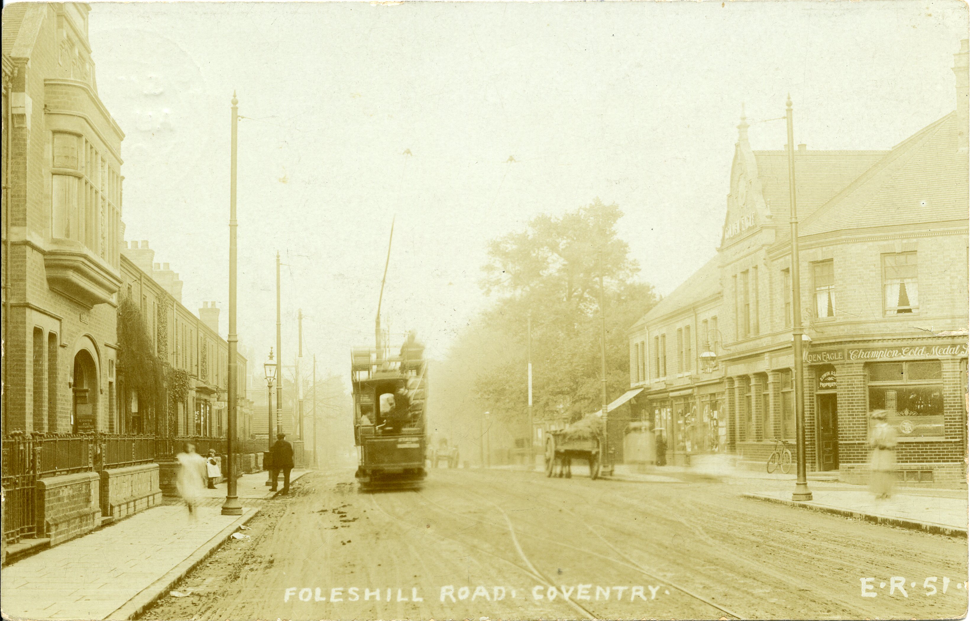 An old, sepia photo of the Foleshill Road with a tram
