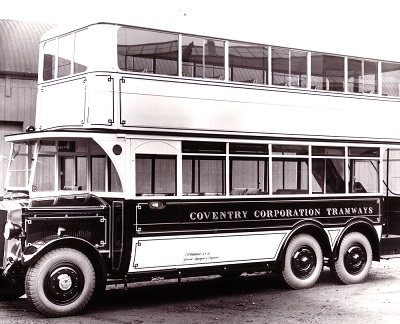 A black and white photo of an old bus with Coventry Corporation Tramways painted on the side