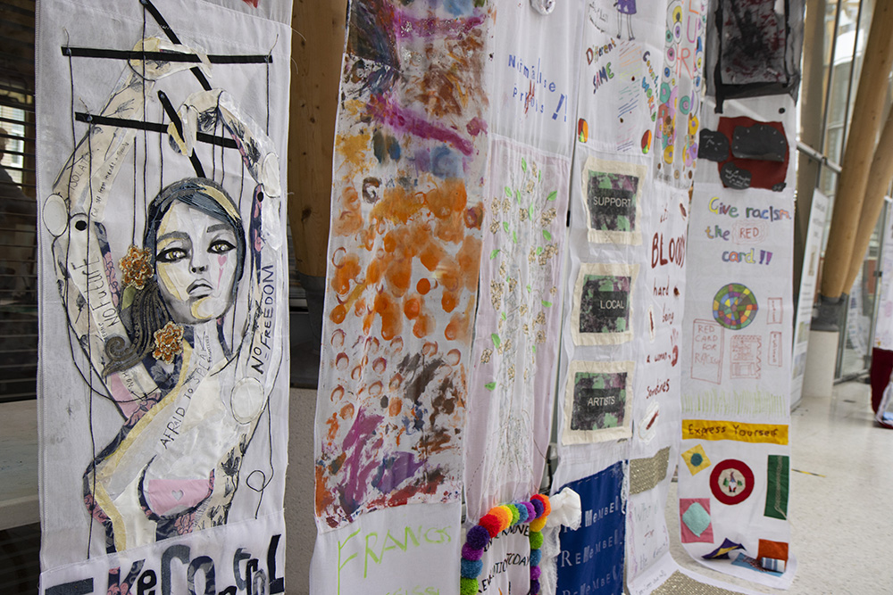 A set of handmade banners on display in the Herbert's covered court