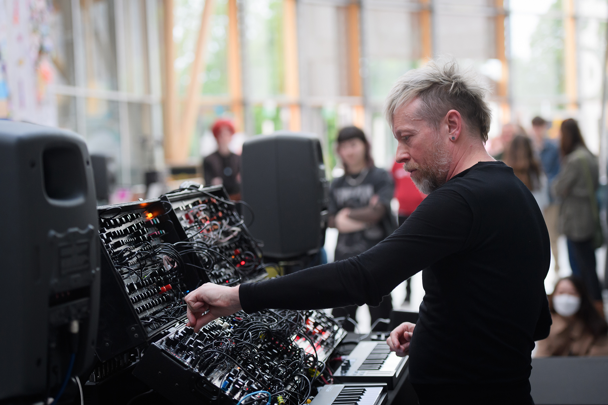 Aaltonen playing a synthesiser in the Herbert Art Gallery & Museum's Covered Court