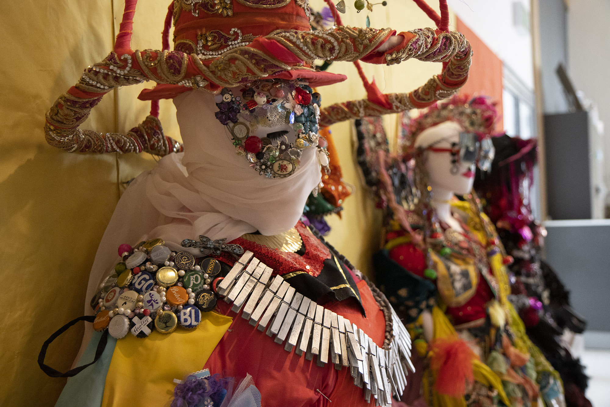 A set of Daniel Lismore-inspired sculptures made by community groups on display. The sculptures are comprised of mannequins dressed elaborately in a range of recycled and repurposed materials, such as fabrics, charity shop clothes and accessories, bottle tops, buttons, beads and jewellery