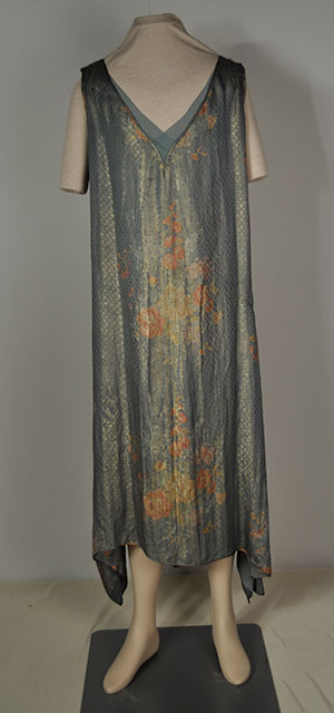 1920s blue v-neck flapper dress with a shimmering gold weave and floral designs