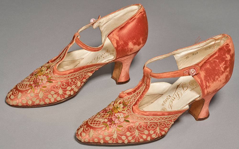 1920s T-bar party shoes covered in peach velvet and embroidered with flowers and lace-like designs