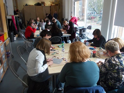 group work around tables, trying sketching techniques