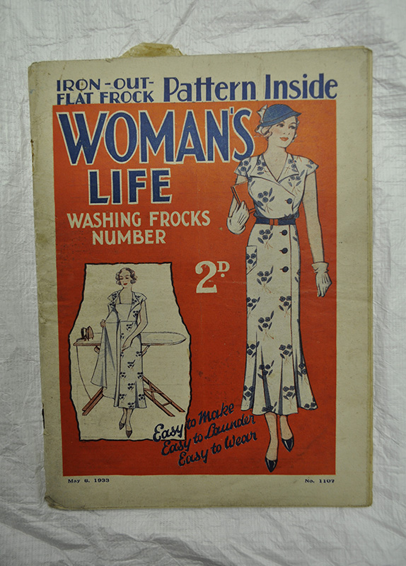 The front cover of a 1930s copy of Woman's Life magazine. The magazine includes a dress pattern and tips on washing frocks