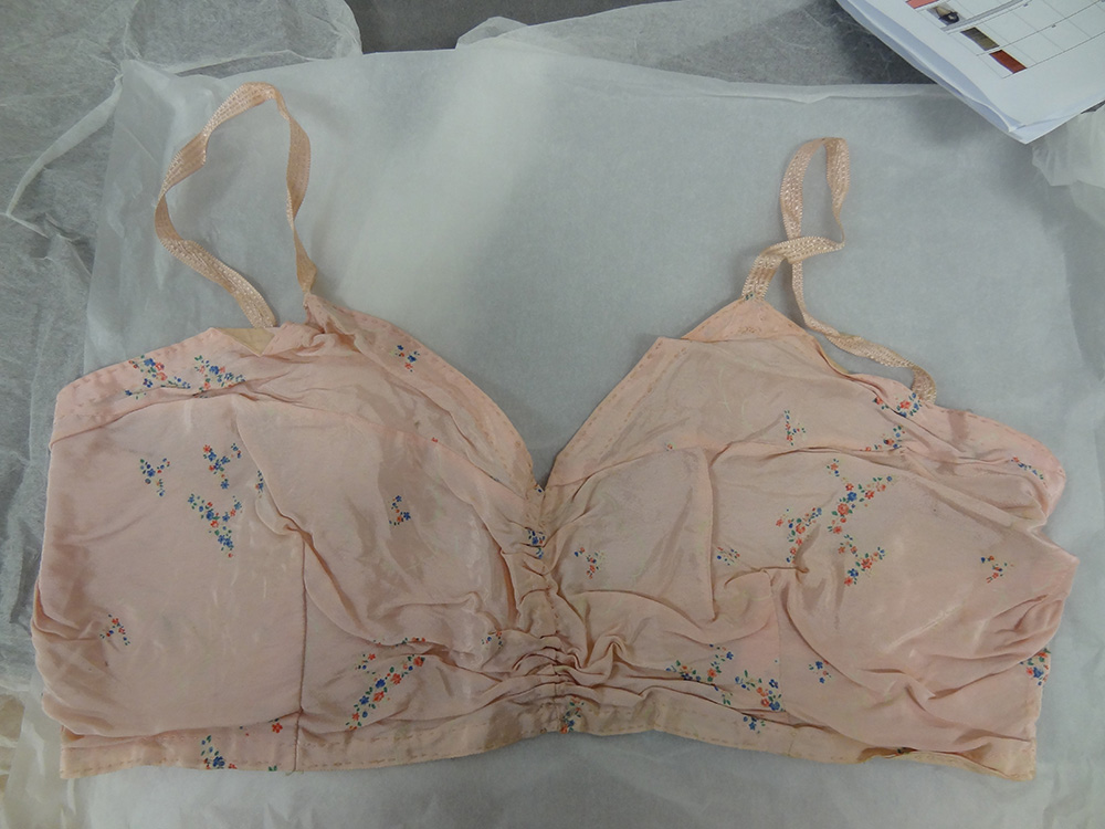 A pale pink, crepe de chine bra, with floral decoration