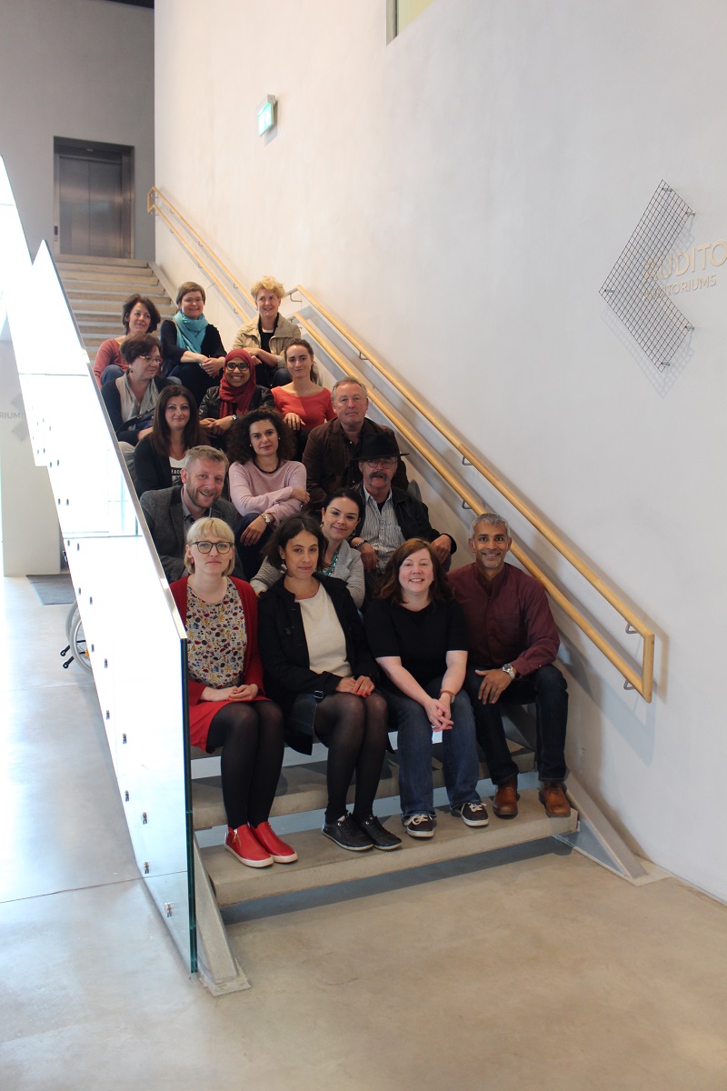 group of people sitting on stairs