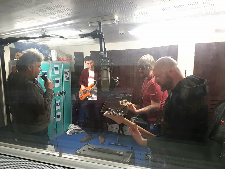 Group of people using a recording studio