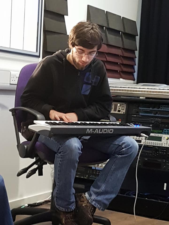 Young man playing a keyboard