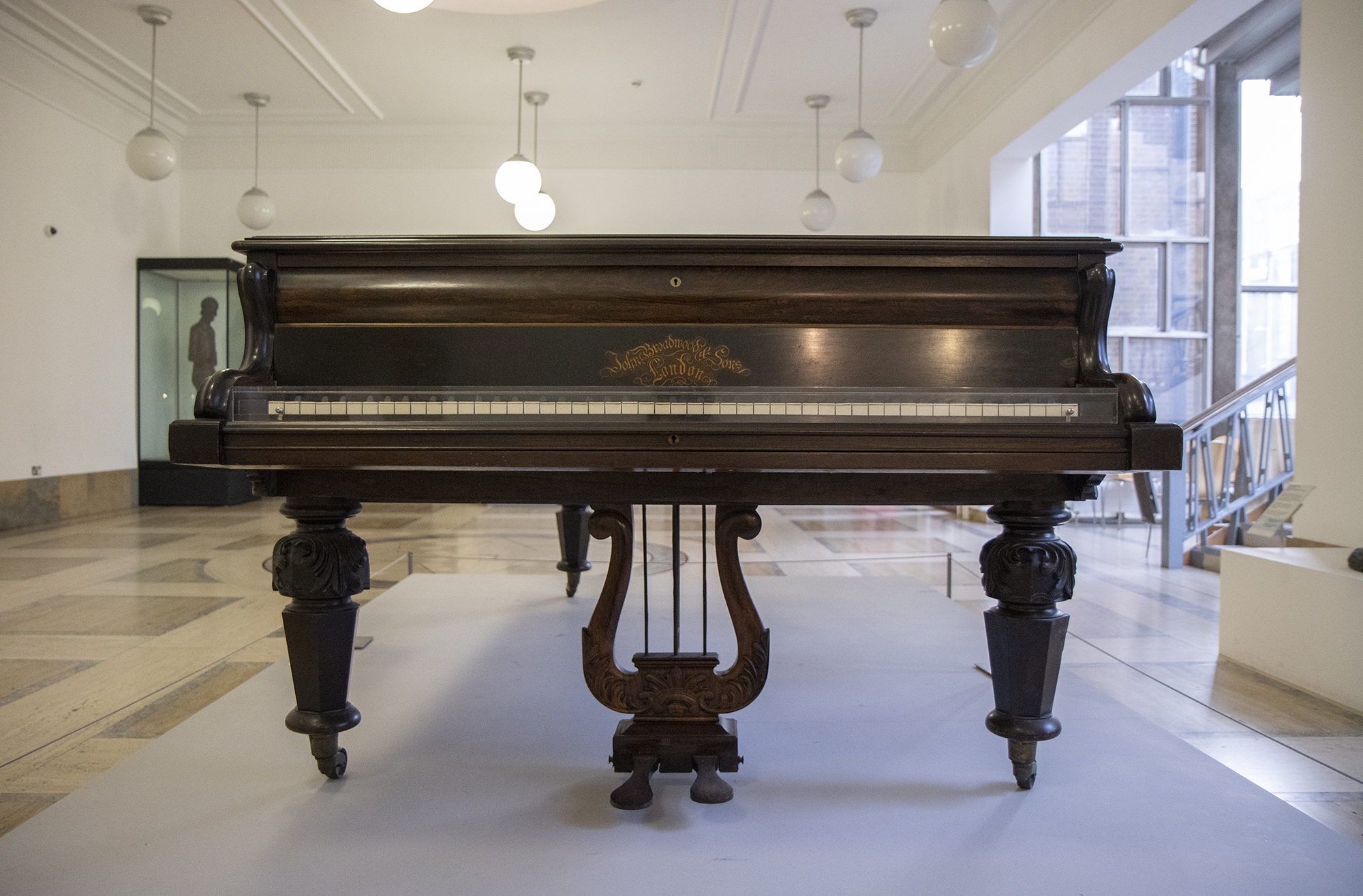 Front view of George Eliot's piano on display in the Herbert Art Gallery & Museum