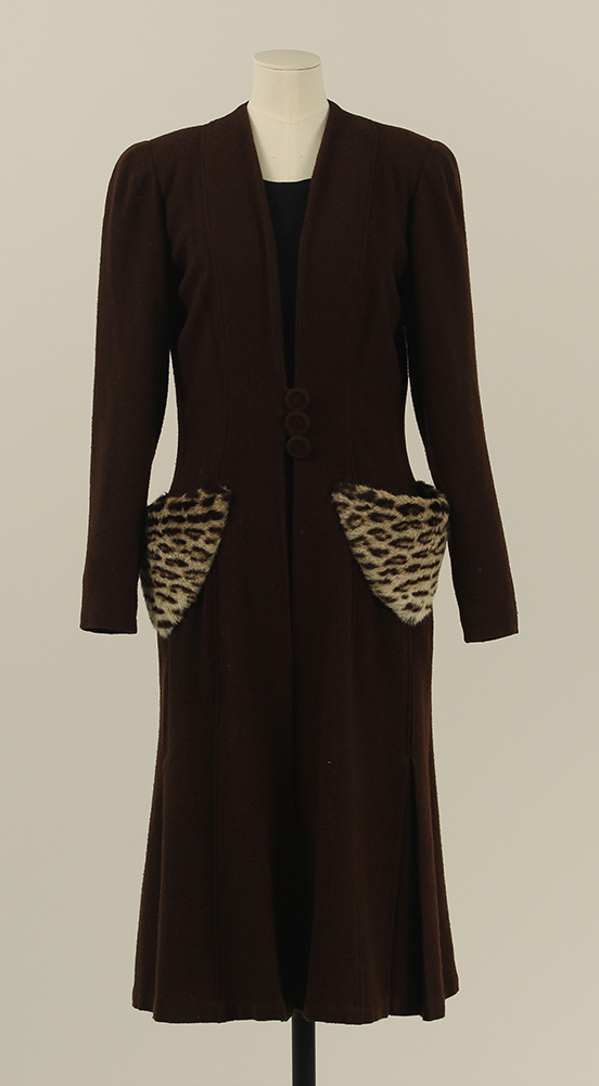 A long black jacket with spotted, ocelot fur pockets