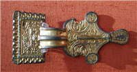 This is a gilded bronze Anglo Saxon brooch.