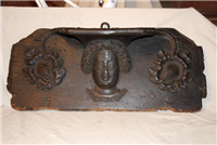 This misericord was a seat used by friars at Whitefriars Friary during services in the church. Misericords were decoratively carved with many subjects. This one shows a woman's head. 