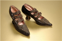 Kid leather shoes. These shoes are made from kid leather, which is from the skin of a young goat. They are lined with pink satin. In Victorian upper and middle class households a woman’s role in life was to marry and produce children. Wealthy middle class